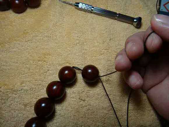 紫檀佛塔打结,小叶紫檀手串侧挂佛头打结方法