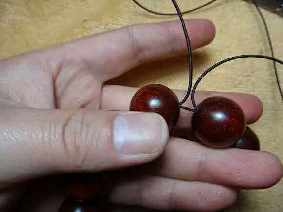 紫檀佛塔打结,小叶紫檀手串侧挂佛头打结方法