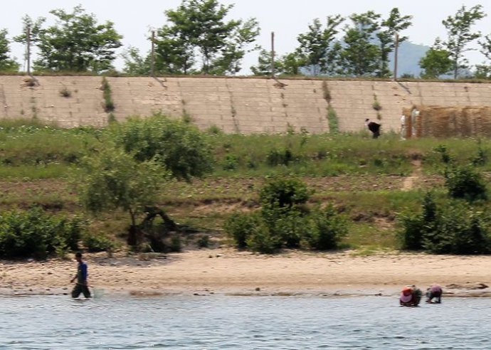 中朝边境美丽的风景,中朝边境桃花盛开的地方