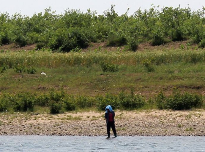中朝边境美丽的风景,中朝边境桃花盛开的地方