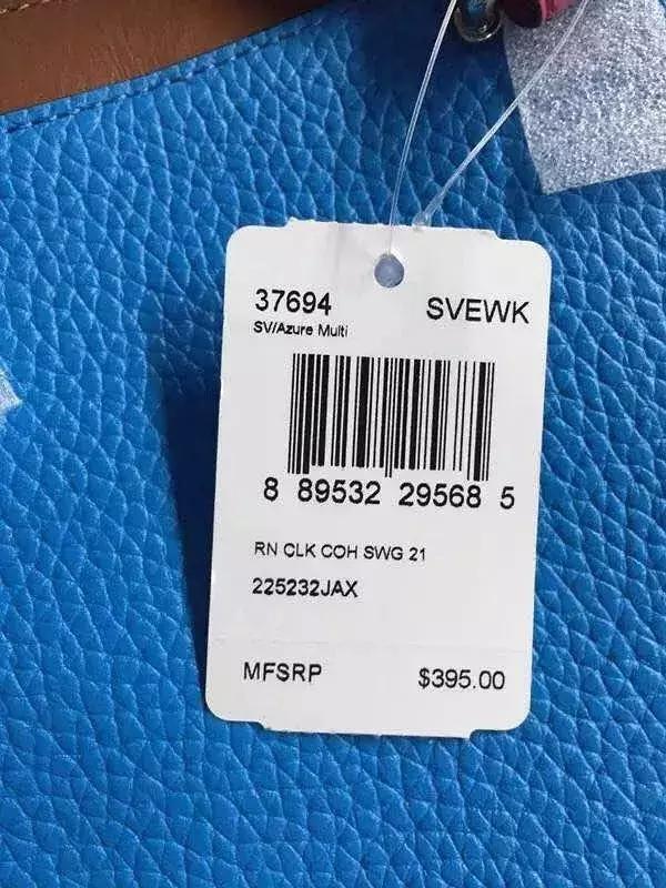 coach的专柜款大红斜挎女包,coach折扣店包跟专柜的区别