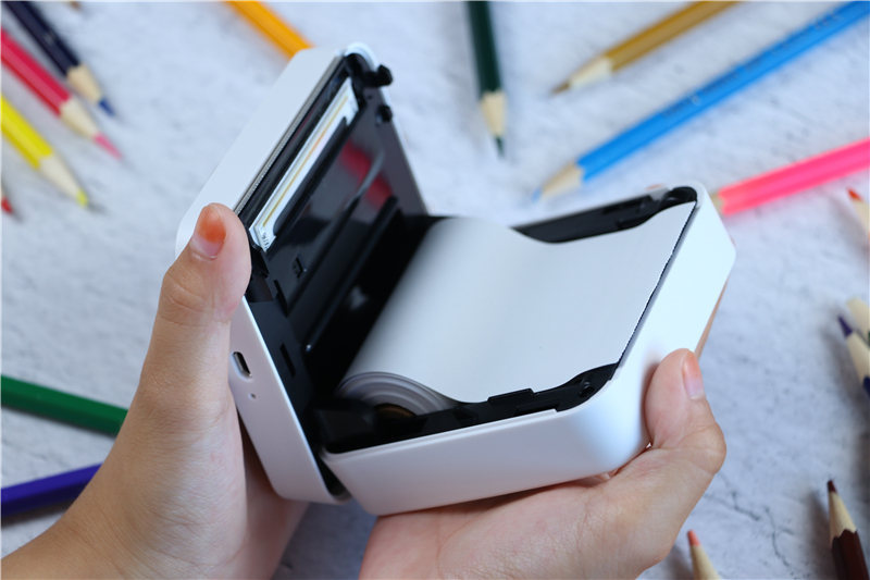 巴掌大小的打印照片的机器,手掌大小的微型口袋书打印