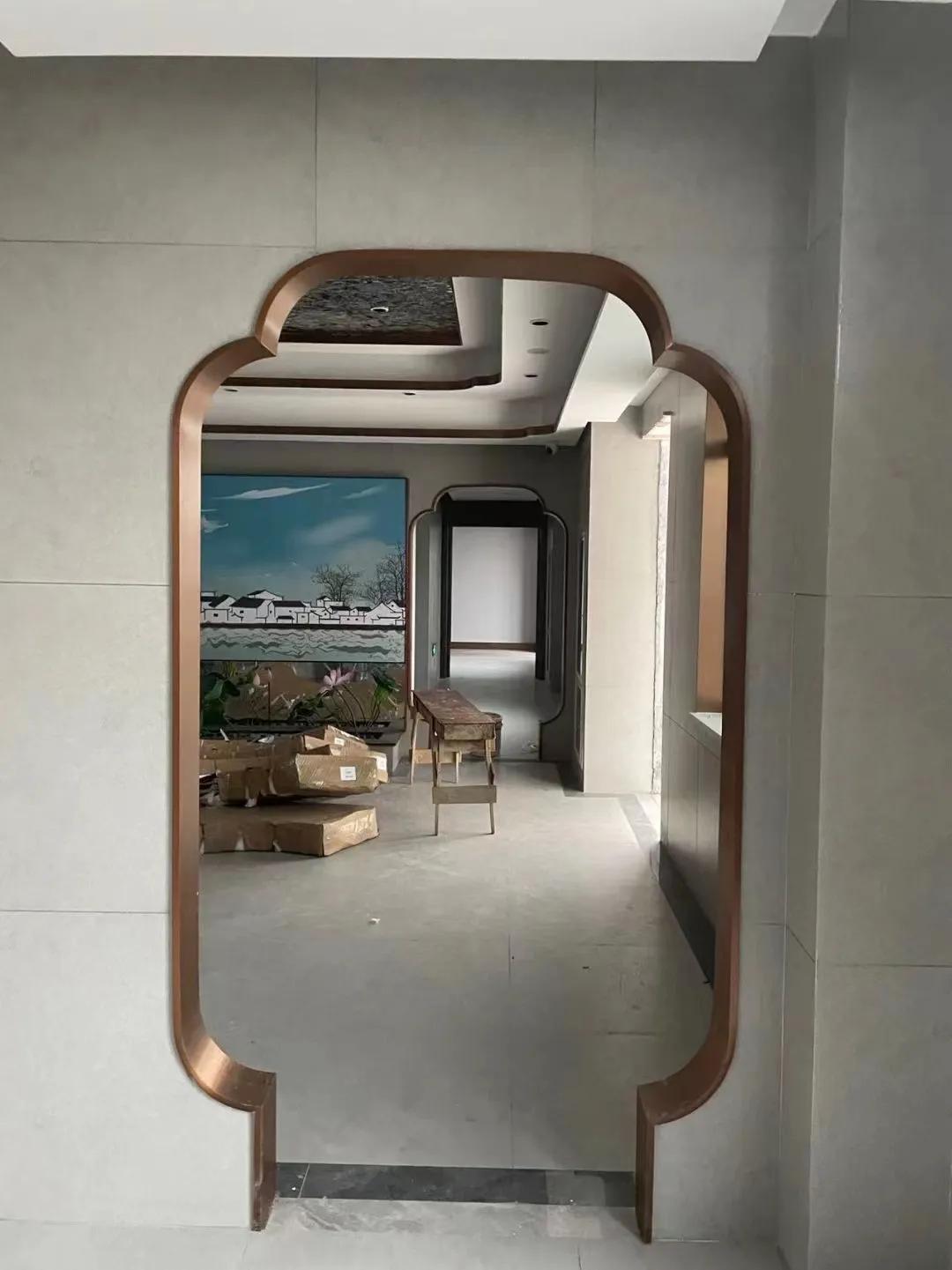 弧形背景墙弧形门套,客厅不锈钢窄边门套造型效果图